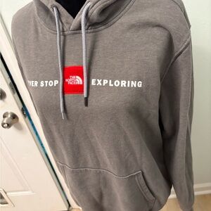 The North Face “Never Stop Exploring” Hoodie – Men’s Medium